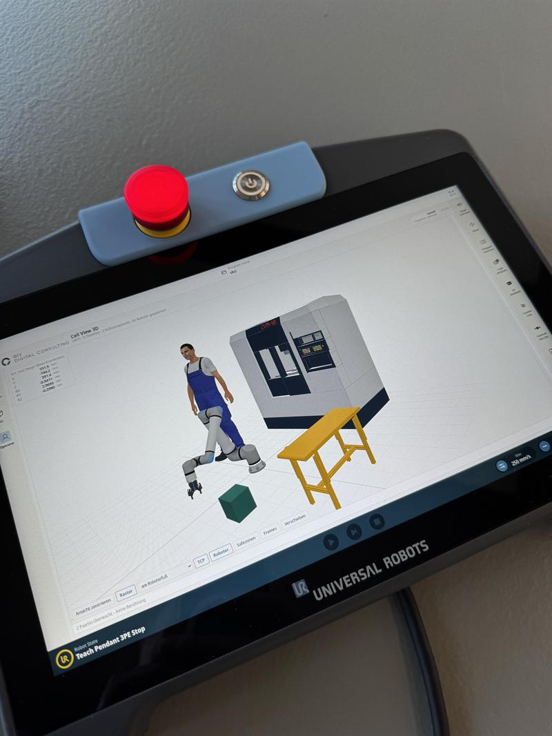 Cell View 3D auf dem Teach Pendant TP7 Core eines UR17g-1300 (UR Gen7): Roboter, Werkzeugmaschine, Tisch und Werker als 3D-Modelle mit Kollisionsüberwachung